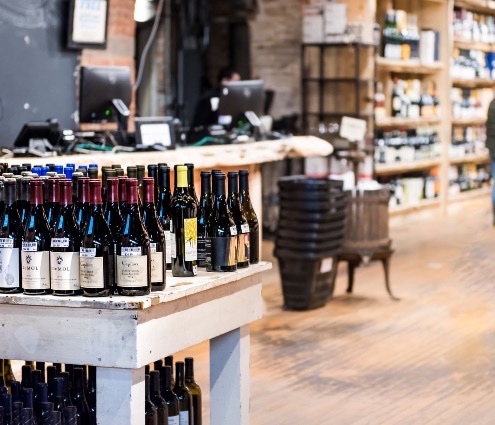 Wine bottles on a table in an independent wine shop